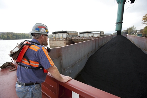 Man in a hard hat standing at a construction site