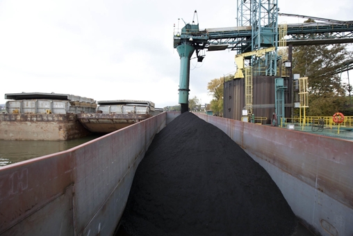Coal being loaded onto a ship for transportation