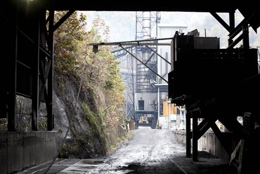 Inside a tunnel, a view of a factory